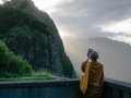 Monk taking a photo with his iPhone
